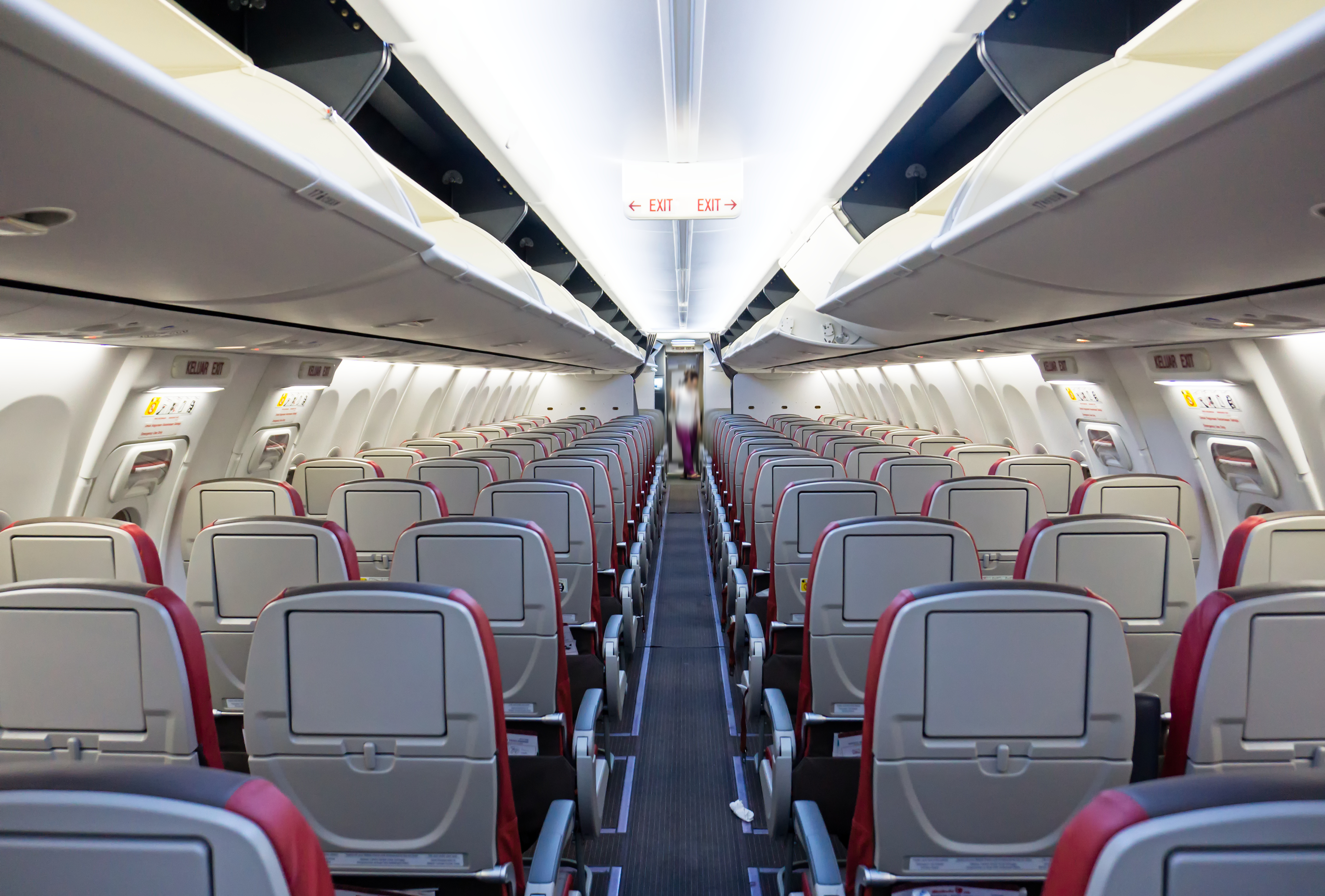 Rows of seats and aisle of a commercial airplane Rows of seats and aisle of a commercial airplane